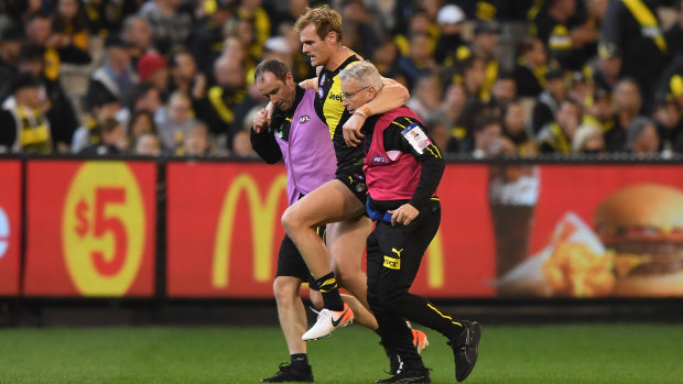 Another blow: More injury woe for Richmond after David Astbury was escorted from the ground.