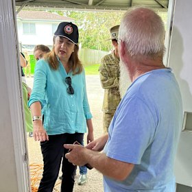 Queensland Premier Annastacia Palaszczuk assesses a flood-damaged home in Deagon on Wednesday. 