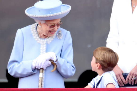 Queen Elizabeth II and Prince Louis of Cambridge on the balcony of Buckingham Palace during Trooping The Colour in London, England. 