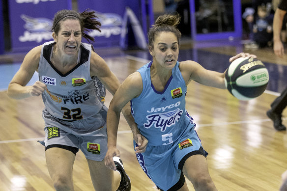 Southside’s Leilani Mitchell (right) gets an edge on Townsville's Micaela Cocks. 
