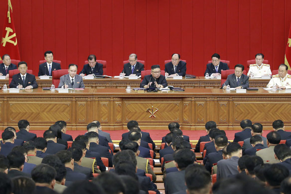 Kim, centre, warned about possible food shortages and called for his people to brace for extended COVID-19 restrictions.