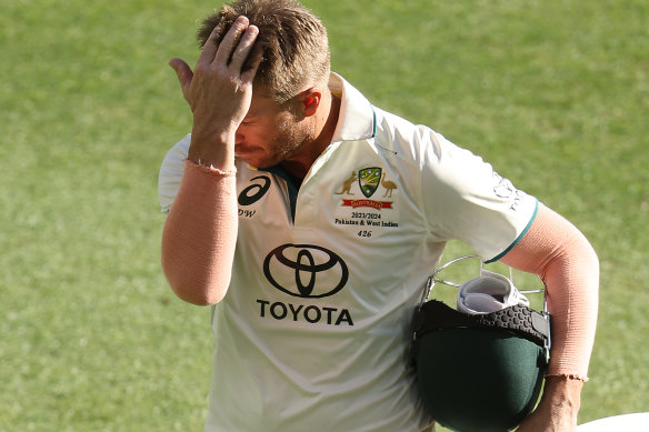 An exhausted David Warner after a big shift at the crease.