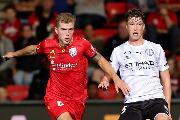 Jack Hendry (right) was seriously injured in a play against Adelaide's Riley McGree (left). 