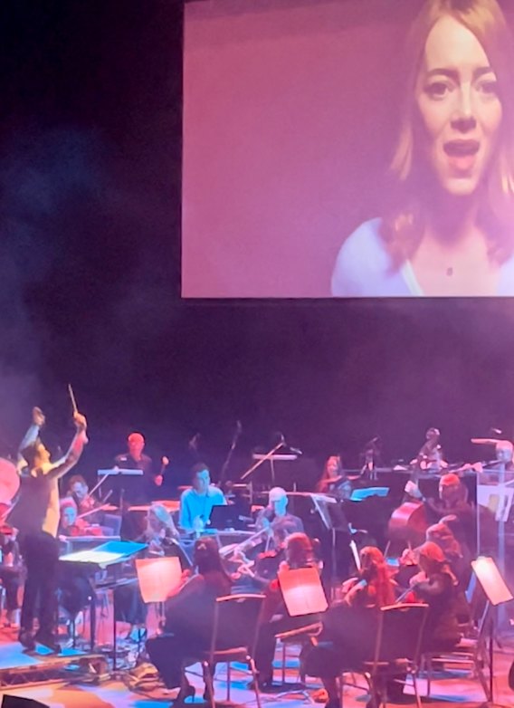 Sterling Nasa (white shirt) plays as Justin Hurwitz conducts La La Land In Concert at Sydney’s Darling Theatre.