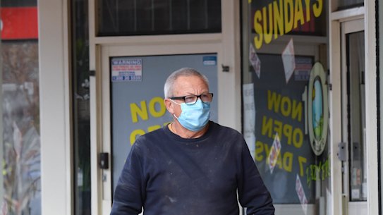 A man in Pakenham wearing a face mask on Friday.