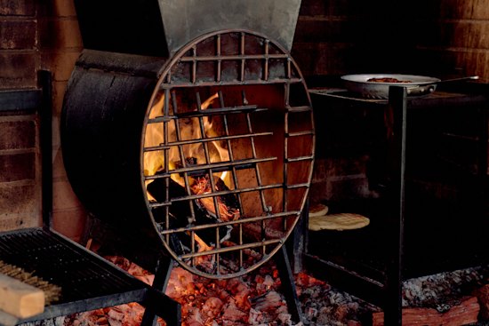 Flatbread and lamb are just some of the dishes cooked over the woodfire coals at Isme.