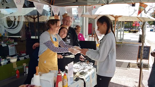Local authors Heather Waugh, Norman Jorgensen and Fiona Burrows man the barbecue. 