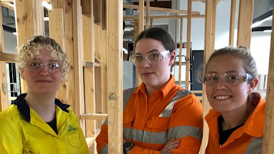 Former chef Bridget Bottcher connected with a new network of women when switching career. Yellow jacket: Lily Kingston, 21; Tallest: Bridget Bottcher, 28; Blonde in orange jacket: Vanessa Tierney, 28.
