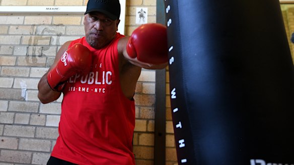 Old stager: John Hopoate works the heavy bag on Thursday.