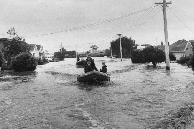 Army dinghies patrol Navigator Street in Maribyrnong during the 1974 flood.