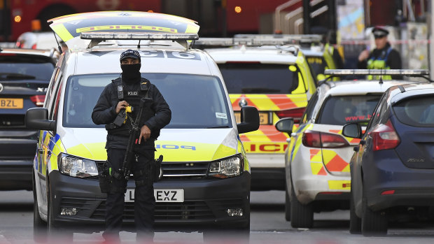 An armed Police officer blocks a street on the south side of London Bridge in London after the attack on Friday.