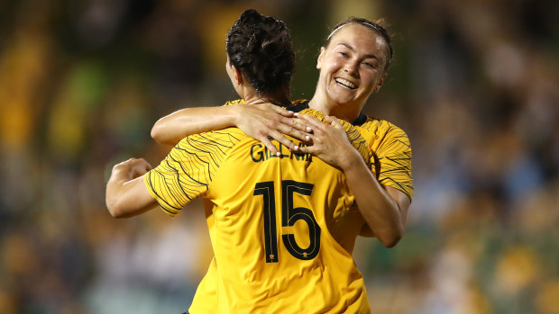 New era: Emily Gielnik celebrates with teammate Caitlin Foord after Gielnik had opened the scoring on Thursday night.