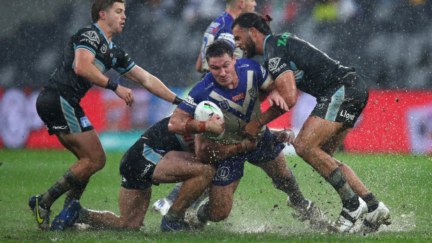 The Sharks beat the Bulldogs in extremely wet conditions in Sydney’s west.