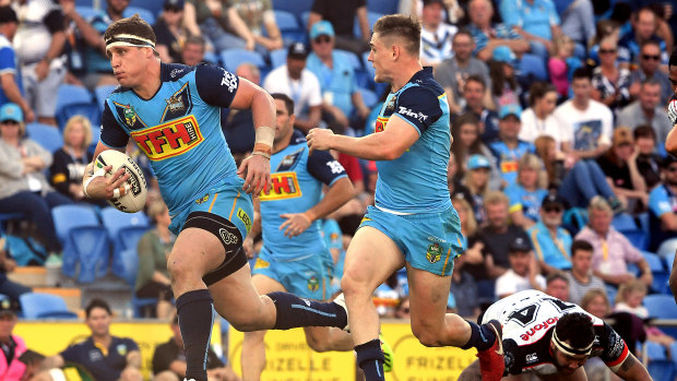 Clean break: Jarrod Wallace storms towards the try line at Cbus Super Stadium on the Gold Coast.