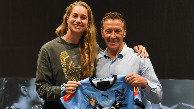 Craig Bellamy presents Blues captain Kezie Apps with her NSW jersey.