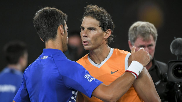 Novak Djokovic and Rafael Nadal embrace after the Serb beat his nemesis in straight sets in the Australian Open final last January.