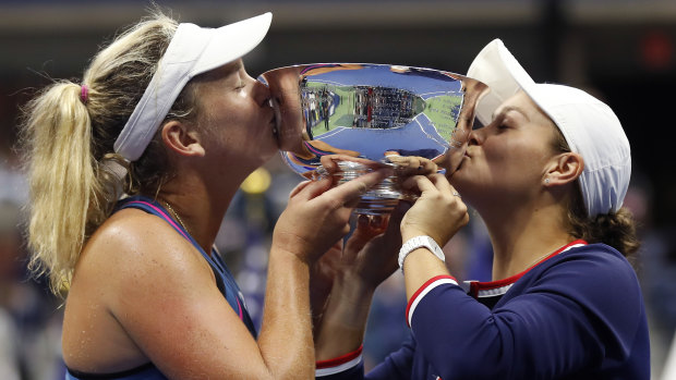 Triumph: Australia's Ashleigh Barty (right) and CoCo Vandeweghe with the spoils of victory following the US Open women's doubles final.
