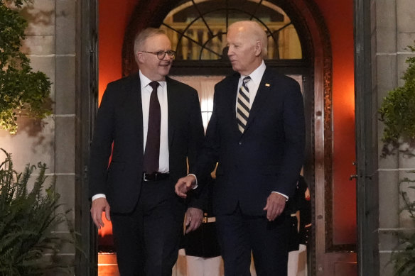 Joe Biden talks with Anthony Albanese as they leave the summit at Archmere Academy.