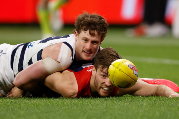 Jack Viney and Jed Bews compete for the ball during Melbourne’s win over Geelong.