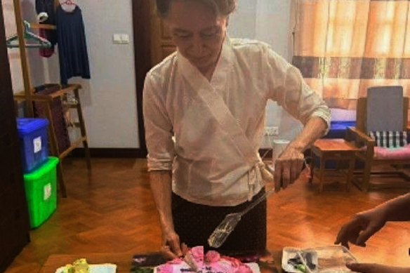 Suu Kyi was shown serving birthday cake in another, apparently older, image released via the Myanmar leadership.