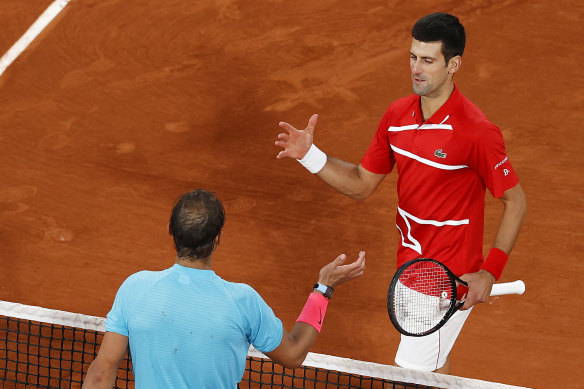 Rafael Nadal, left,  shakes hands with Novak Djokovic, right, after winning another French Open. 
