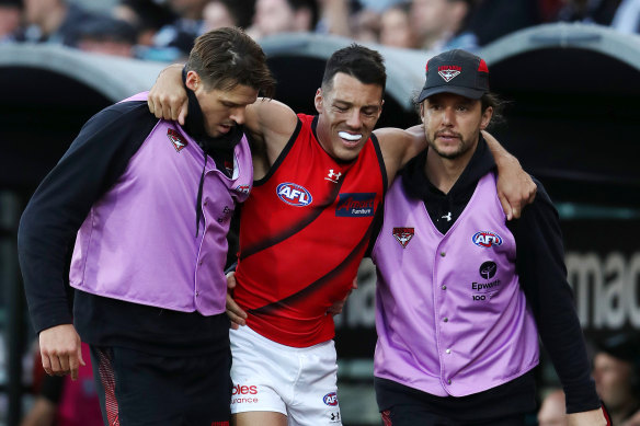 Dylan Shiel is helped to the bench on the weekend. 