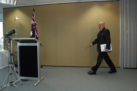 John Howard releasing the Flood inquiry report, 22 July 2004. Philip Flood wrote: “Australia shared in the allied intelligence failure on the key question of Iraq WMD stockpiles.”