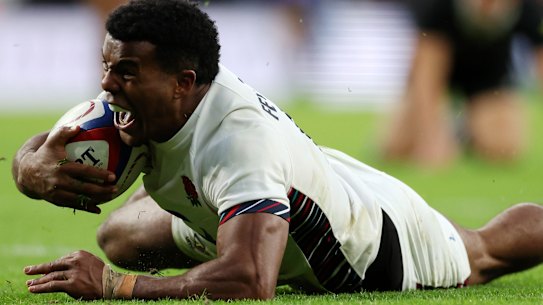 England’s Immanuel Feyi-Waboso celebrates after scoring against the All Blacks.