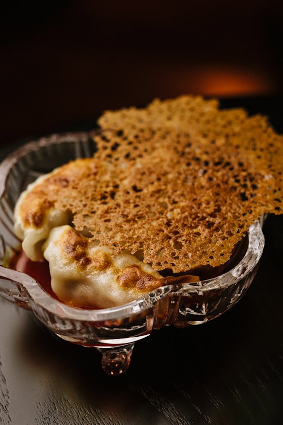 Pan-fried pork &amp; prawn dumplings with fermented chilli and white soy.