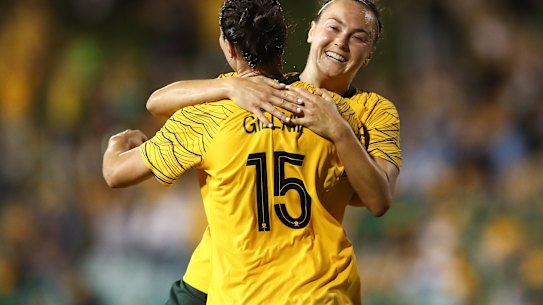 New era: Emily Gielnik celebrates with teammate Caitlin Foord after Gielnik had opened the scoring on Thursday night.