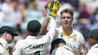 Australia’s Cameron Green at rear, celebrates with teammates after taking the wicket of India’s Shardul Thakur.