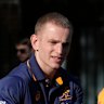 Australian rugby union player Max Jorgensen goes through a skills drill with students at Stanmore Public School in Sydney, Australia, Thursday, June 19, 2025, after the announcement of the squad that will that will be considered for a position in the three-test series against the British and Irish Lions. (AP Photo/Rick Rycroft)