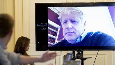 Boris Johnson pictured chairing a recent COVID-19 meeting remotely.