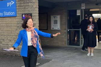 Chisholm Liberal MP Gladys Liu, in blue, and Labor candidate Carina Garland, at Mount Waverley railway station.