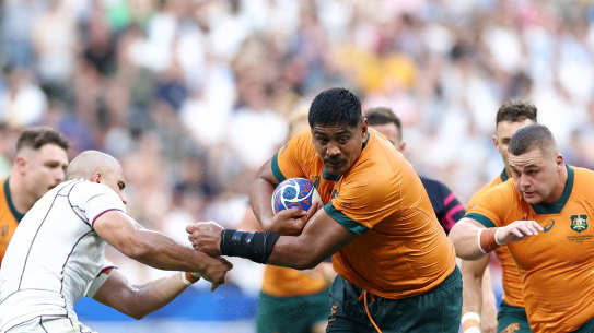 Captain Will Skelton is tackled by Beka Gorgadze of Georgia