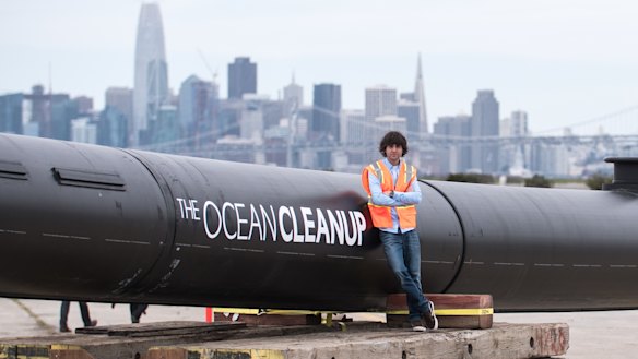 Boyan Slat beside the ocean barrier that will be deployed in the Pacific Ocean.