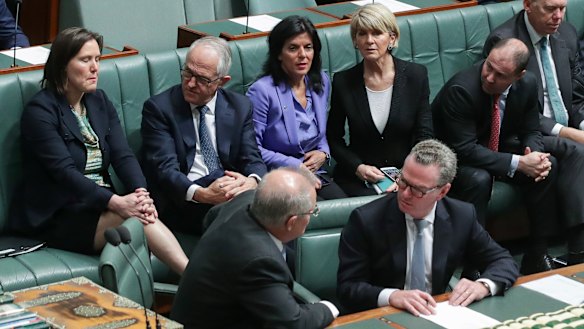 Ms Banks beside Malcolm Turnbull and Julie Bishop last Thursday, their final day leading the Liberal Party.