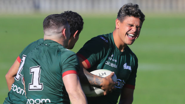 Latrell Mitchell shares a laugh at training.
