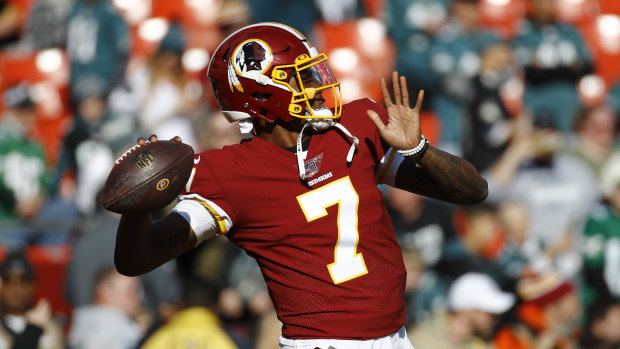 Washington Redskins quarterback Dwayne Haskins warms up before a game in 2019.