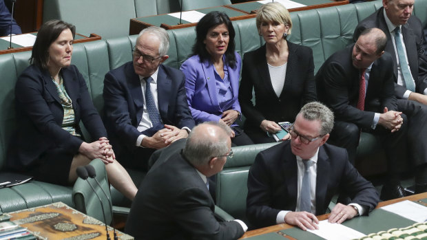 Ms Banks beside Malcolm Turnbull and Julie Bishop last Thursday, their final day leading the Liberal Party.