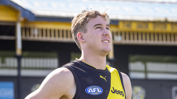 Game ready: Tigers recruit Tom Lynch in front of the Jack Dyer Stand at Punt Road Oval.