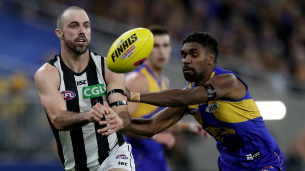 Steele Sidebottom disposes of the ball under pressure from Liam Ryan.