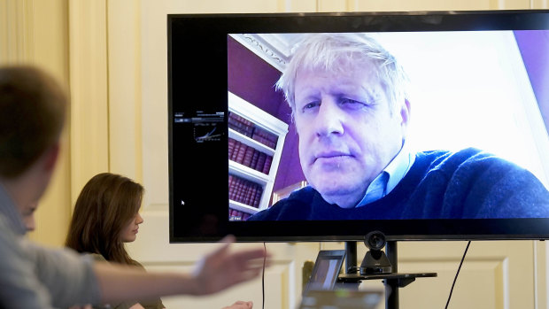 Boris Johnson pictured chairing a recent COVID-19 meeting remotely.