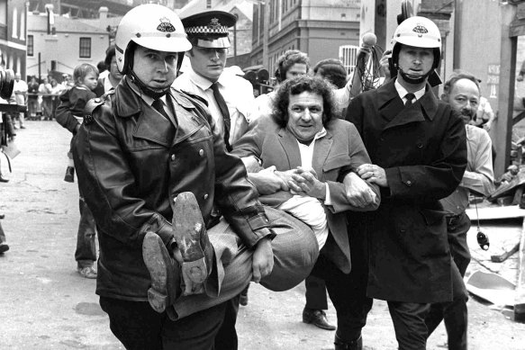 A file picture of Jack Mundey being carried from a protest at The Rocks in the early seventies.