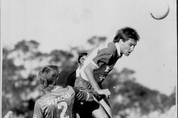 Paul Wade heads the ball in a match for South Melbourne against Marconi in Sydney in 1987.