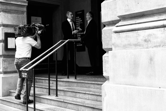 Bill Johnston being interviewed outside Petition on May 30.