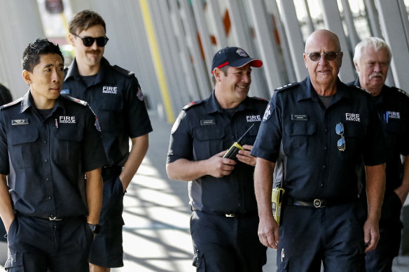 Members of Fire Rescue Victoria arrive at the Royal Exhibition Building for their vaccine.