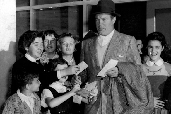 Bob Hope is mobbed by autograph hunters arriving in Sydney in 1955.