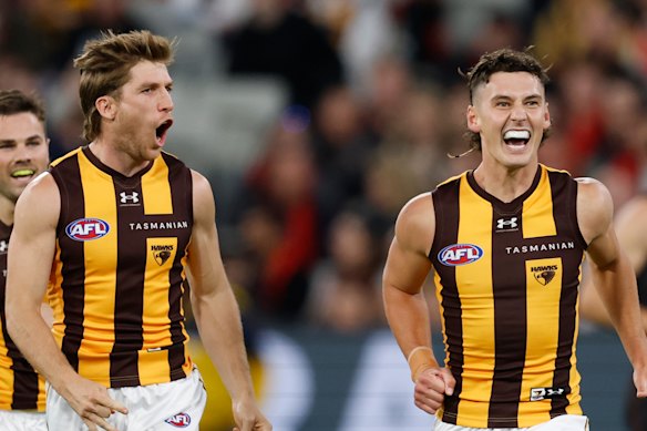 Dylan Moore and Connor Macdonald are in action for the Hawks against Essendon after reports of their Arizona defections emerged.