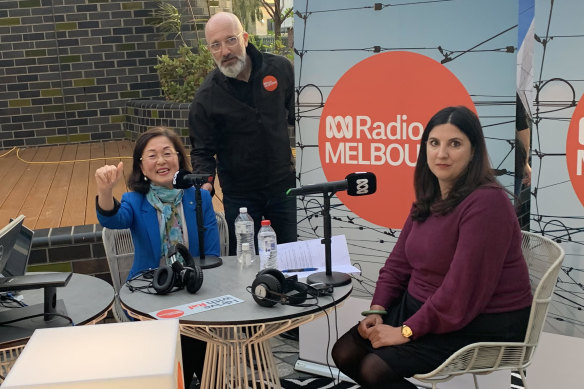 Liberal MP for Chisholm Gladys Liu (left), ABC journalist Raf Epstein, and Labor’s candidate for the seat Carina Garland at The Glen shopping centre in Glen Waverley on Thursday afternoon.